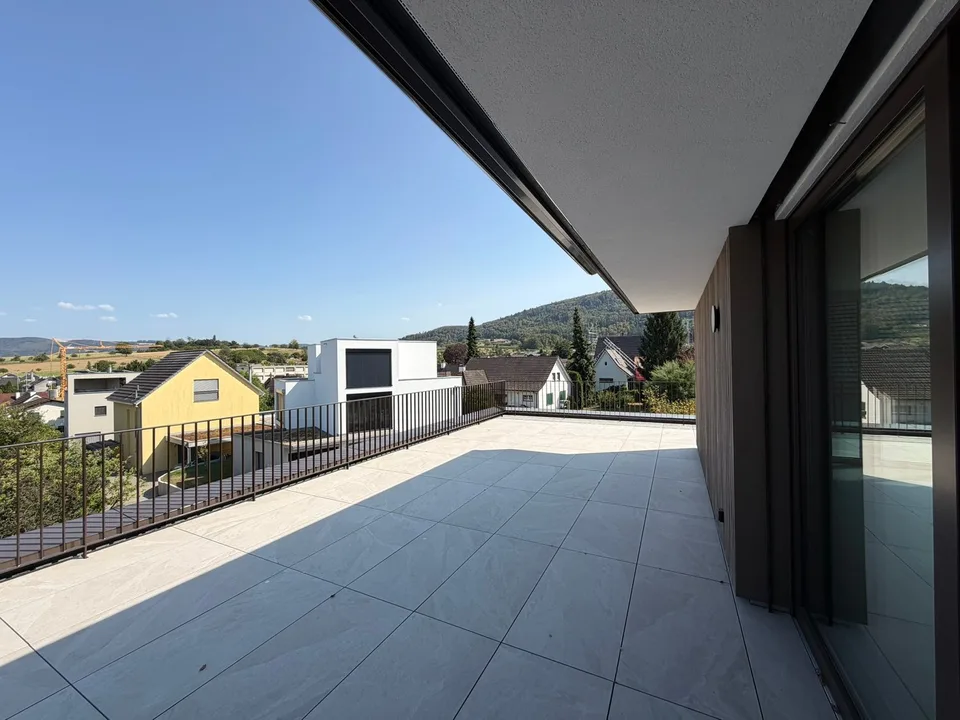 Appartamento mansardato moderno 2.5 locali in un edificio nuovo con una terrazza spaziosa