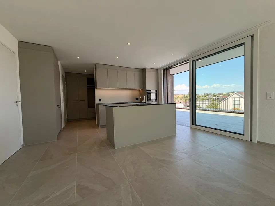 Appartamento mansardato moderno 2.5 locali in un edificio nuovo con una terrazza spaziosa