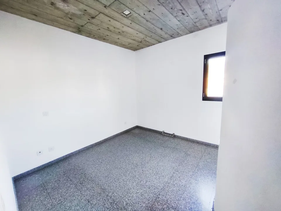 Intéressante maison bifamiliale de deux 3,5 pièces avec jardin à proximité du centre