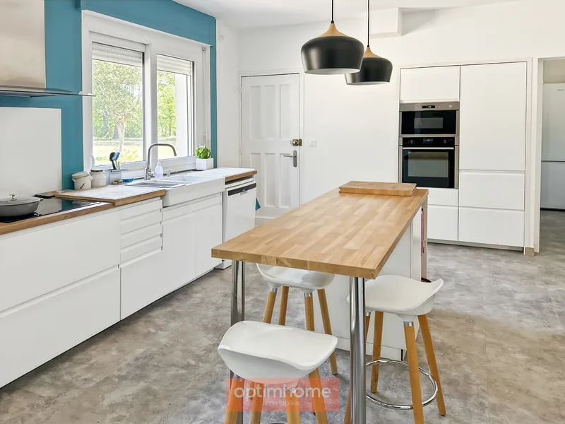 A charming, renovated house full of charm and character on its wooded park