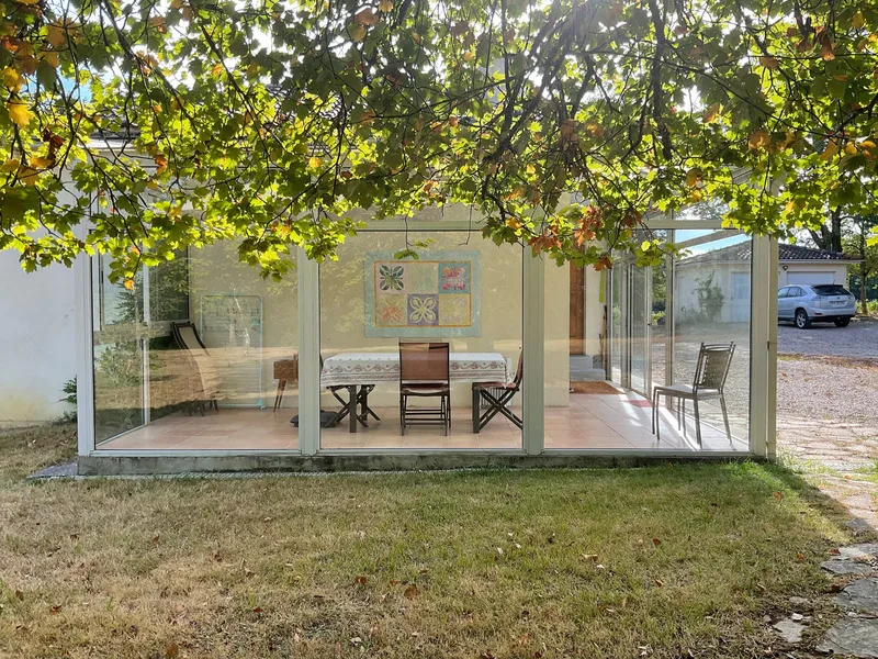 A charming, renovated house full of charm and character on its wooded park