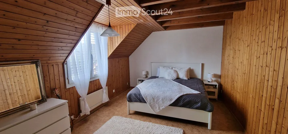 Charming corner row house with garden, garage & parking space in Neuwilen