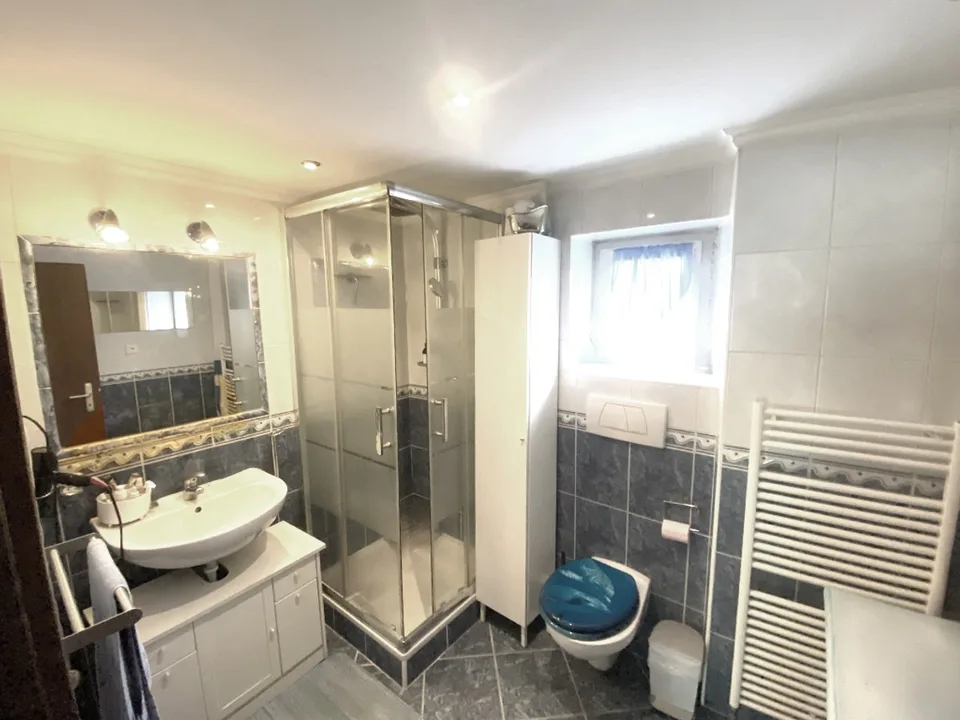 Renovated 7-room core house with garden, grotto, and attic.
