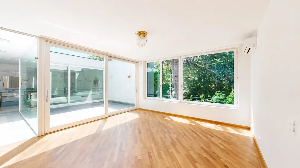 Representative 284sqm attic apartment with lift, two underground parking spaces, three balconies, and private sauna