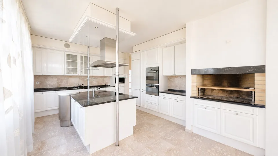 Representative 284sqm attic apartment with lift, two underground parking spaces, three balconies, and private sauna