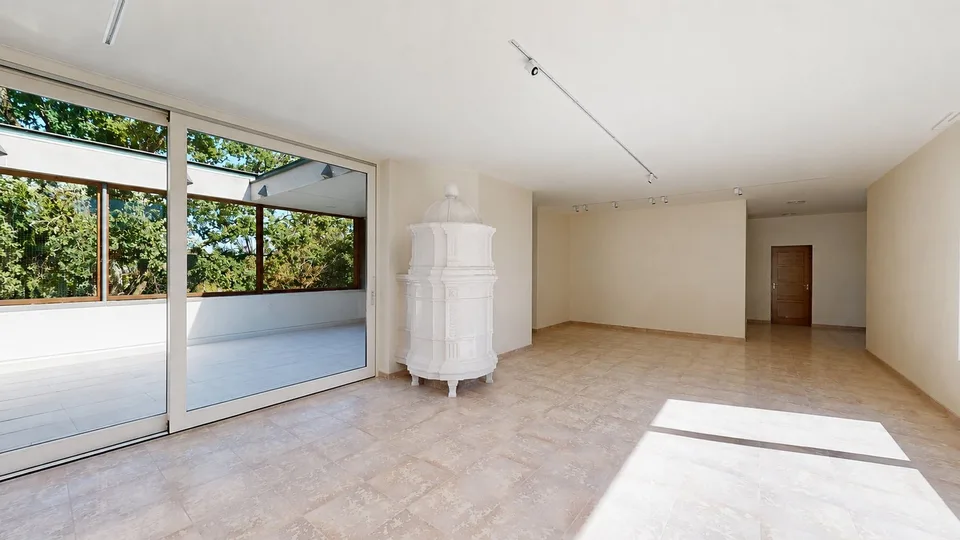 Representative 284sqm attic apartment with lift, two underground parking spaces, three balconies, and private sauna