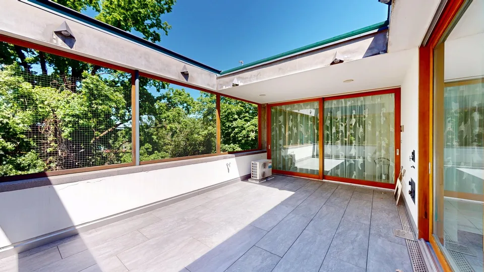 Representative 284sqm attic apartment with lift, two underground parking spaces, three balconies, and private sauna