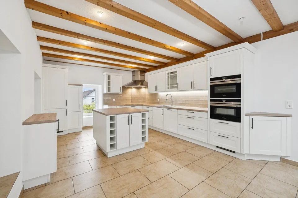 Exclusive single-family house with garden in Büsserach