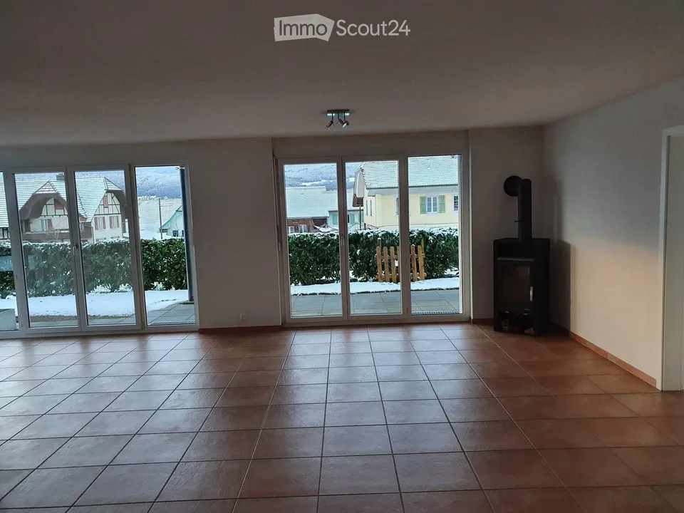 Modern ground-floor apartment with lake view and private garden