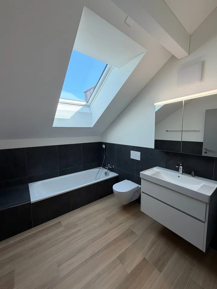 Appartement de charme 3.5 pièces en mansarde dans un immeuble neuf 103 m² avec beaucoup de lumière & de charme