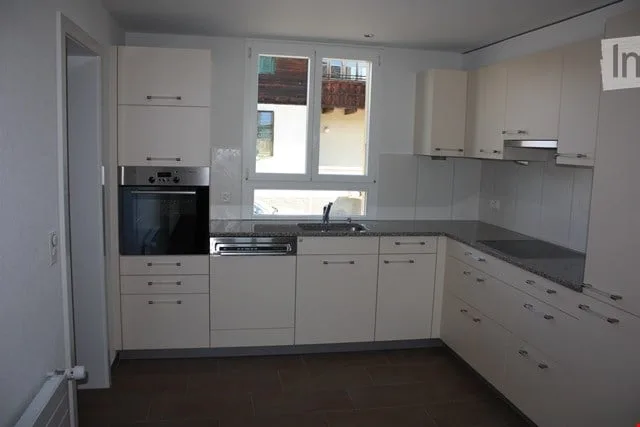 Appartement lumineux dans une maison de 2 familles avec jardin – situé au centre et confortable