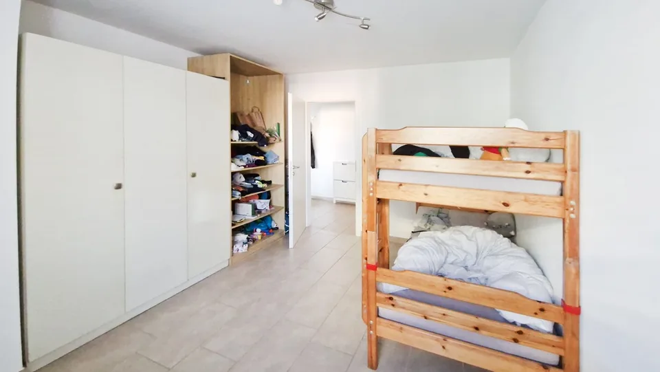 Elegante ampio 3,5 con balcone coperto e posteggio in autorimessa