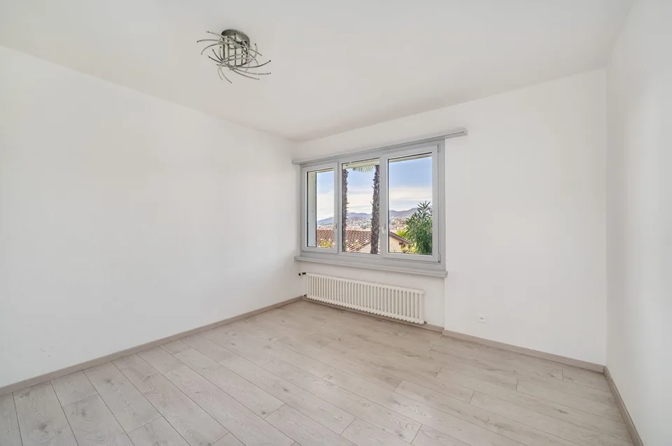 VILLA 5.5 LOCALI CON VISTA CITTÀ E LAGO DI LUGANO