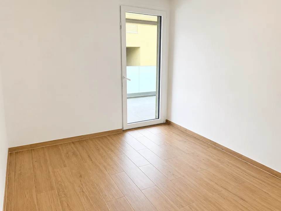 1er étage – Neuf – Places de parc intérieure – Grand balcon
