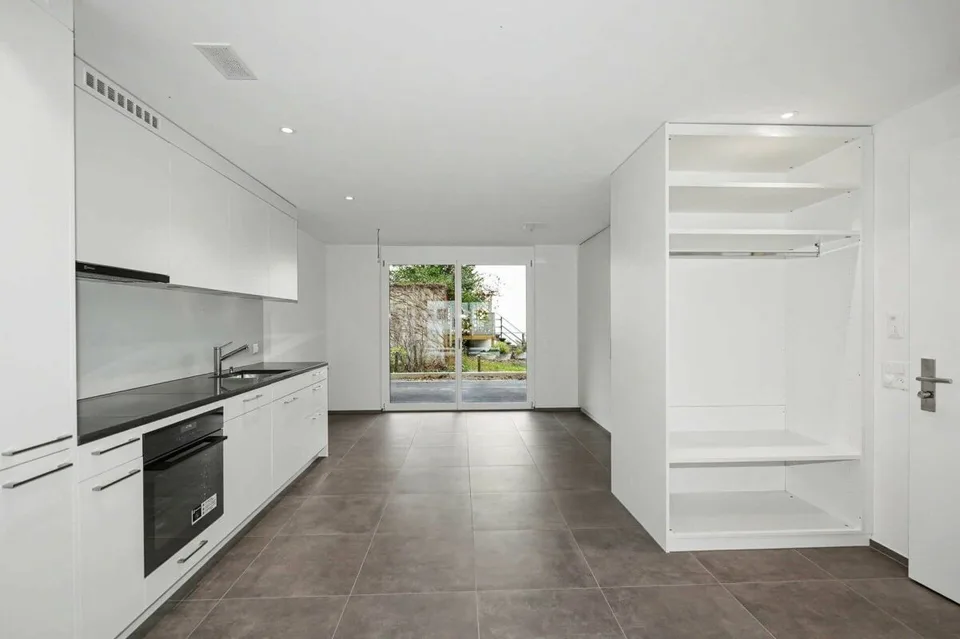 Modern 1-bedroom apartment with garden seating in Hölstein