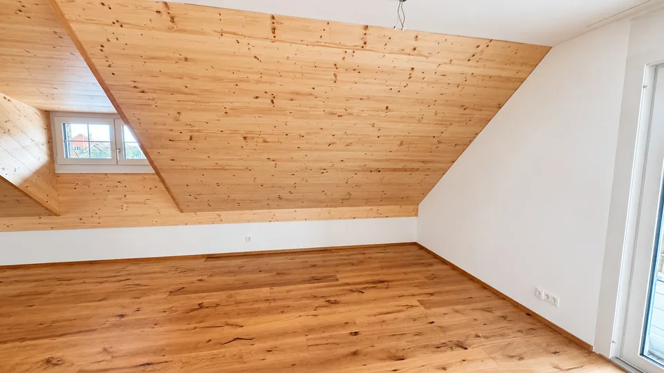 Bright attic apartment with modern renovation and charming wood details