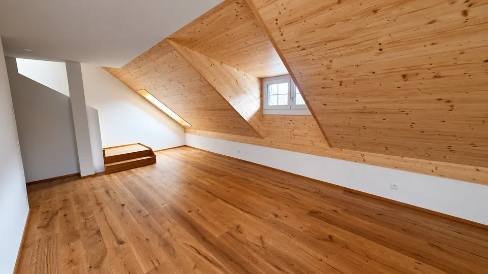 Bright attic apartment with modern renovation and charming wood details