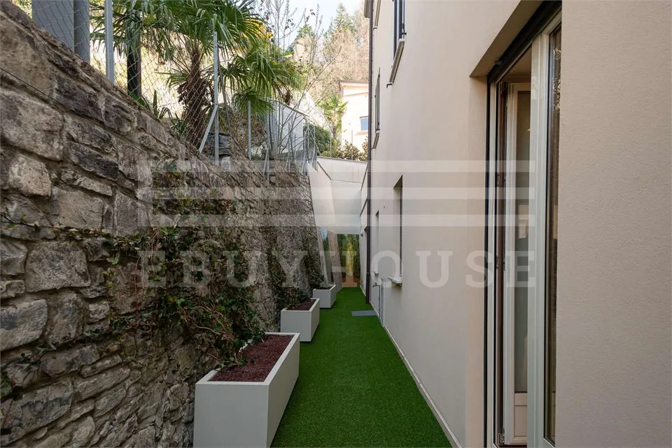 Prestigeses Appartement mit privatem Garten in Cassarate – Foto 13 von 13