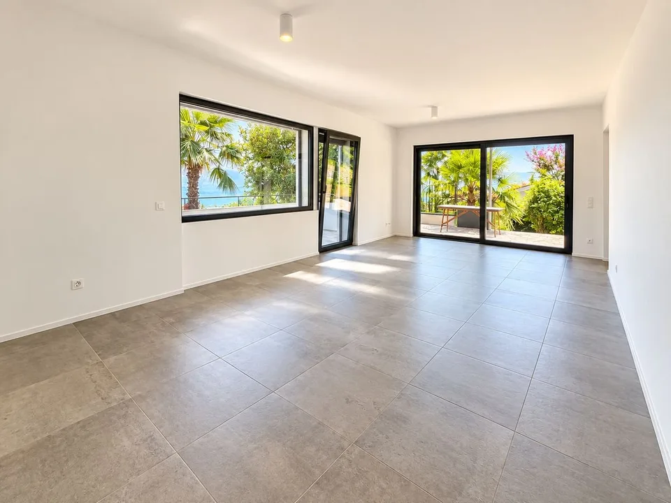 Porza - Elegantische 3.5-Zimmer-Wohnung mit Seeblick, Terrasse und privatem Garten – Foto 2 von 12