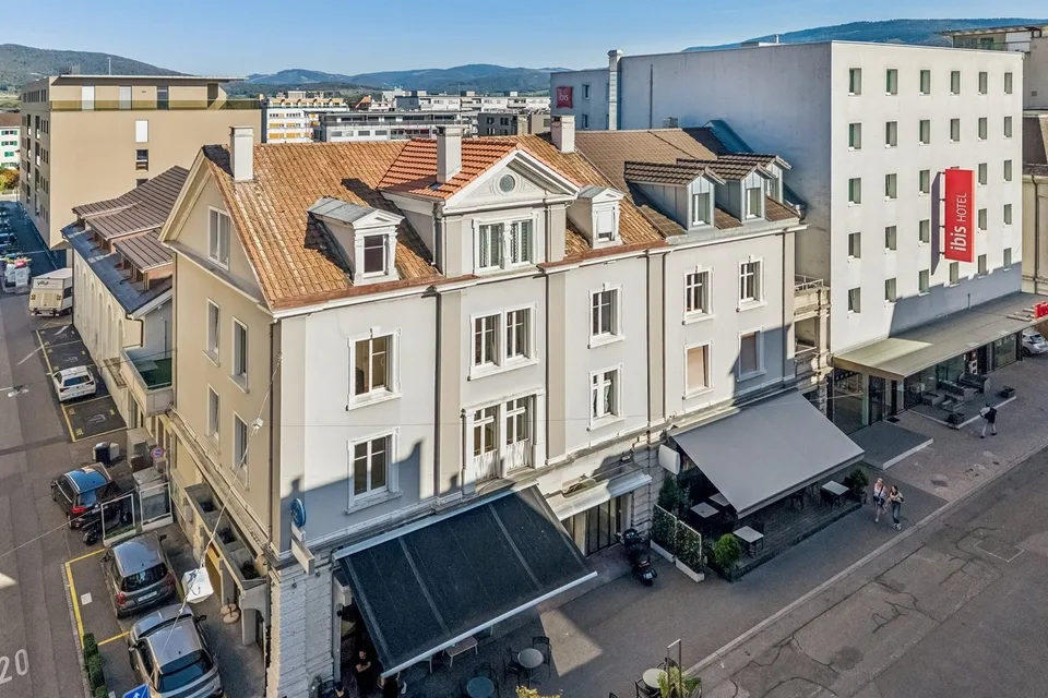 Immeuble de caractère mixte et de rendement au coeur de Delémon – photo 4 sur 13