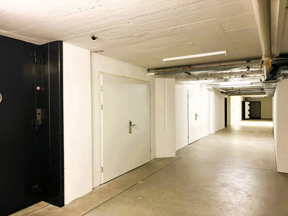 104 m² Lagerraum im 1. UG mit Anlieferungsrampe und Warenlift - Steinhausen – Foto 10 von 14