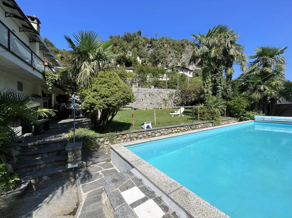 APPARTEMENT 2.5 PIÈCES LUMINEUX AVEC PISCINE ET GRAND JARDIN À BARBENGO – photo 9 sur 10
