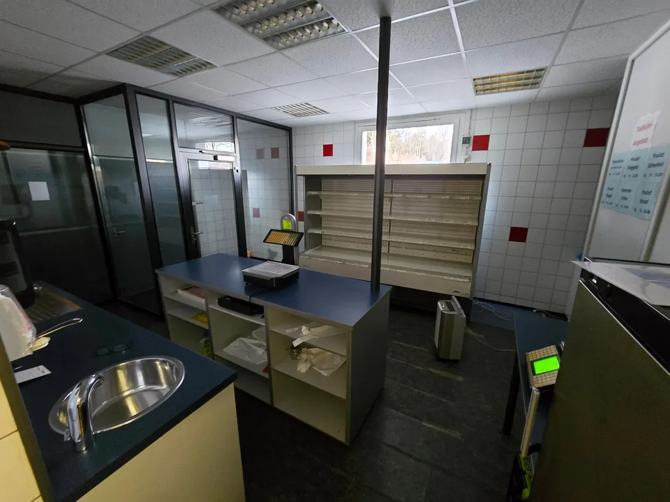 Fully equipped butcher shop with sales area and storage space