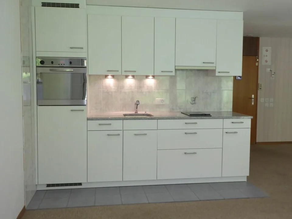 Appartement de vacances en studio de 1,5 pièces avec espace de jardin et place de parking souterrain
