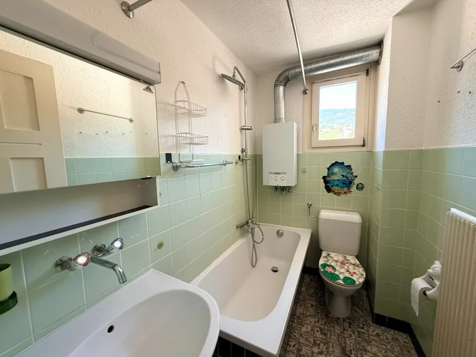 Multi-family house with 4 residential units in a central location in Bellach
