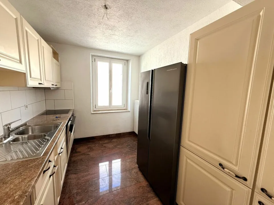 Multi-family house with 4 residential units in a central location in Bellach