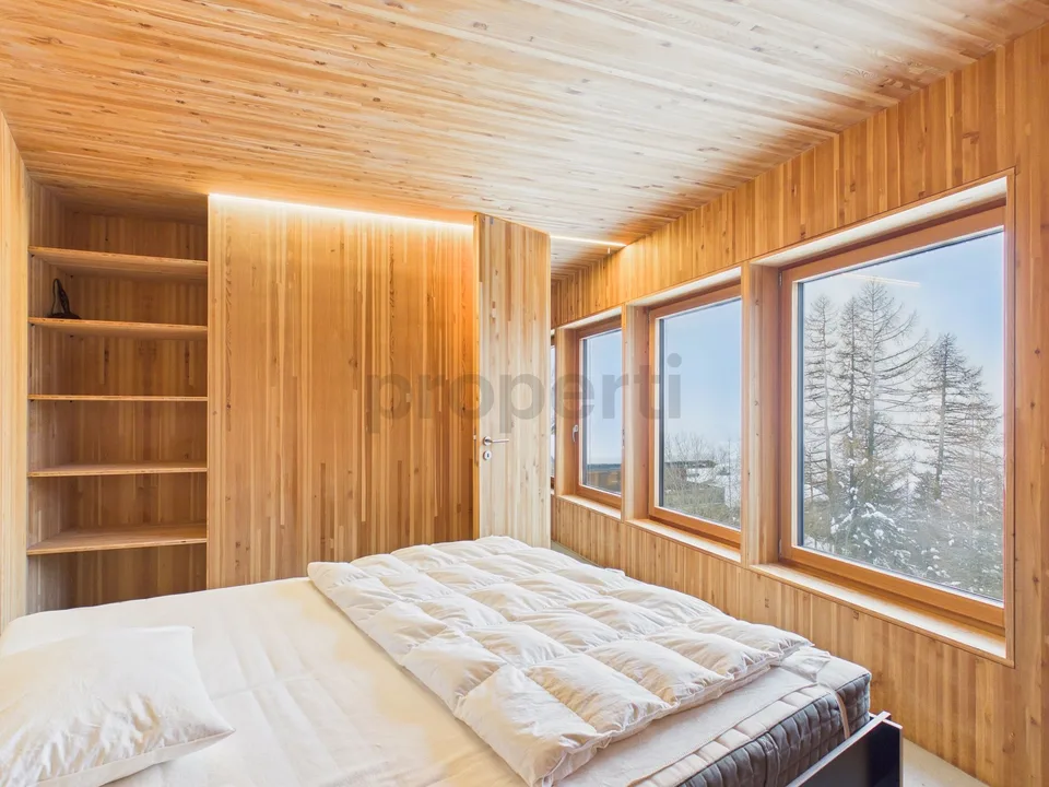 Casa unifamiliare architettonicamente eccezionale in una posizione panoramica di prima classe nelle Alpi svizzere - una seconda casa con comfort abitativo e vista ampia