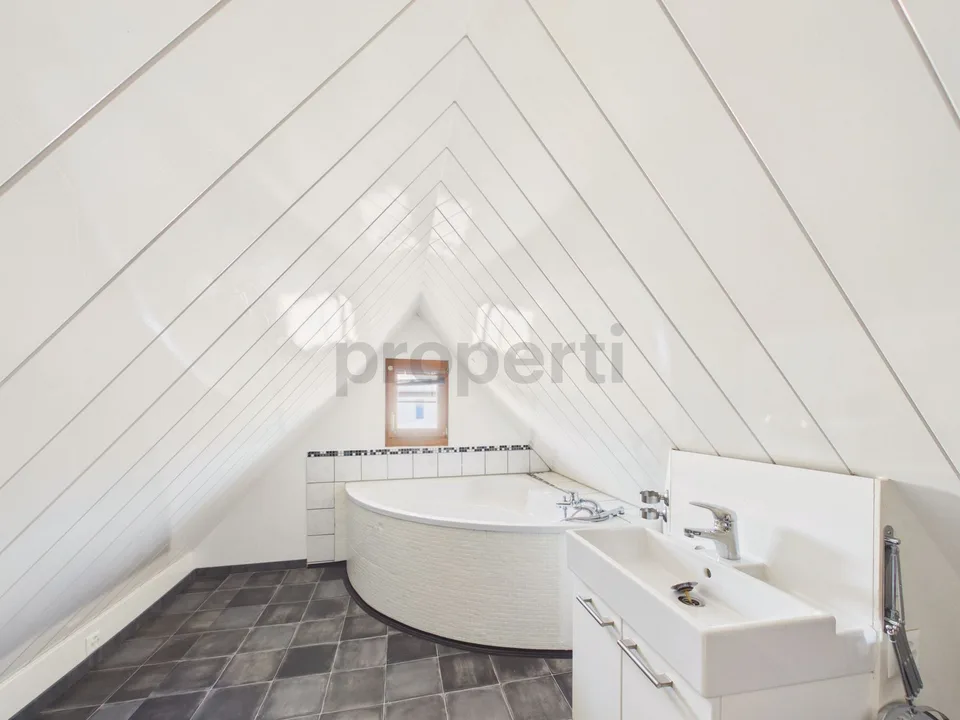 Three living levels, historic wooden beams, and a private entrance near Lake Untersee
