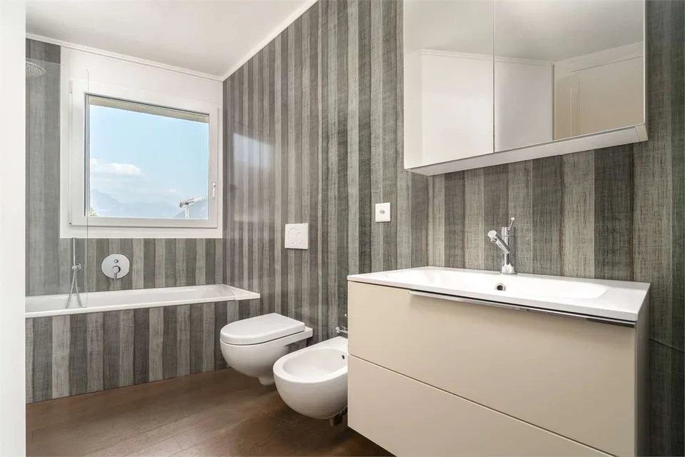 Melide - appartement moderne de 4,5 pièces avec vue sur le lac et jardin sur le toit