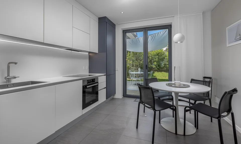 STUNDEVOLLER UND MODERNER 2,5 ZIMMER MIT BEQUEMEM GARTEN IN MASSAGNO – Foto 2 von 9