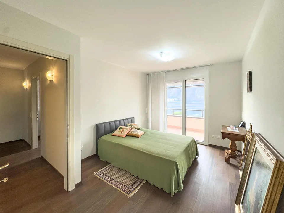 Appartamento vista lago con giardino a Bissone – foto 5 di 13