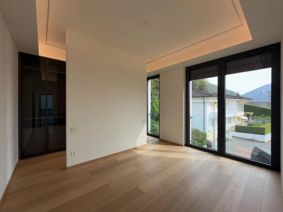Ampio attico con magnifica terrazza vista lago a Bissone – foto 9 di 15