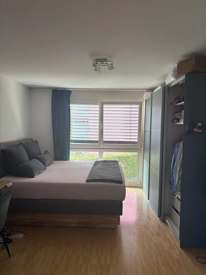Spacious room with private bathroom in modern apartment