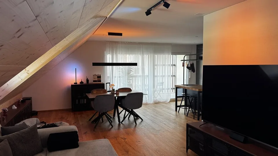 Bright attic apartment with modern renovation and charming wood details